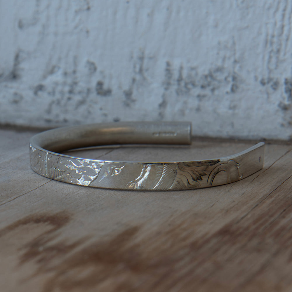 Men's silver bracelets and bangles by Alice Made This. Celebrating the art of hand engraving. 