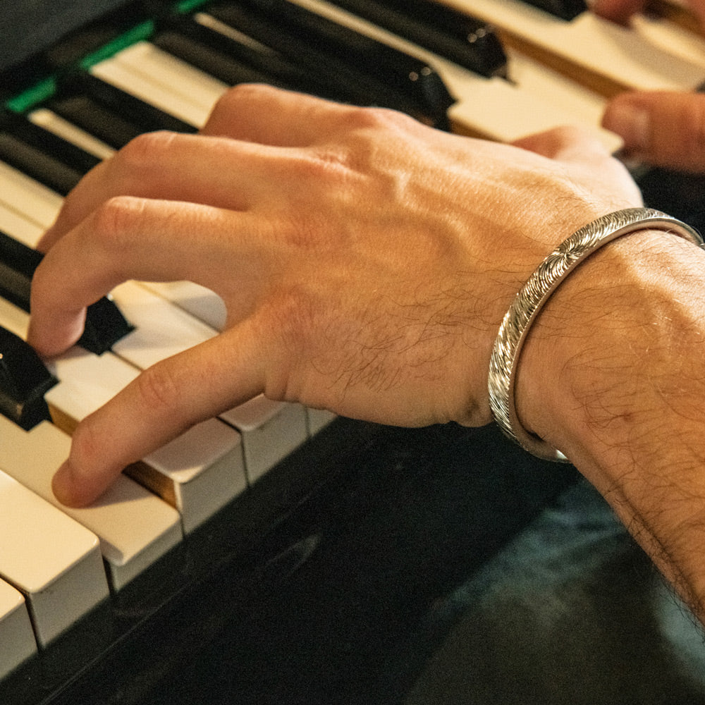 Cuff bracelets in silver for men. Celebrating the art of hand engraving. 