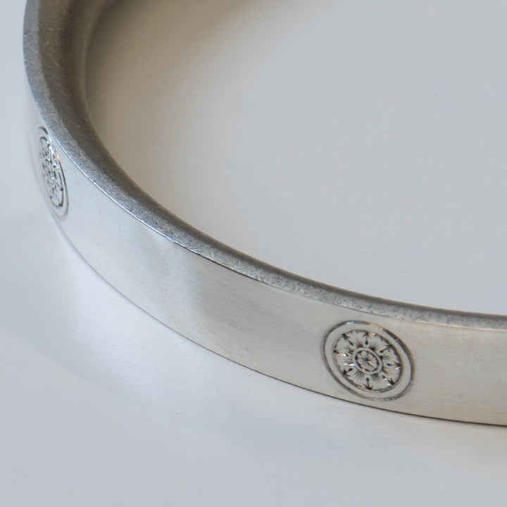 Minimalist silver bracelets for men. Hand engraved rose motif inspired by heraldic motifs. 