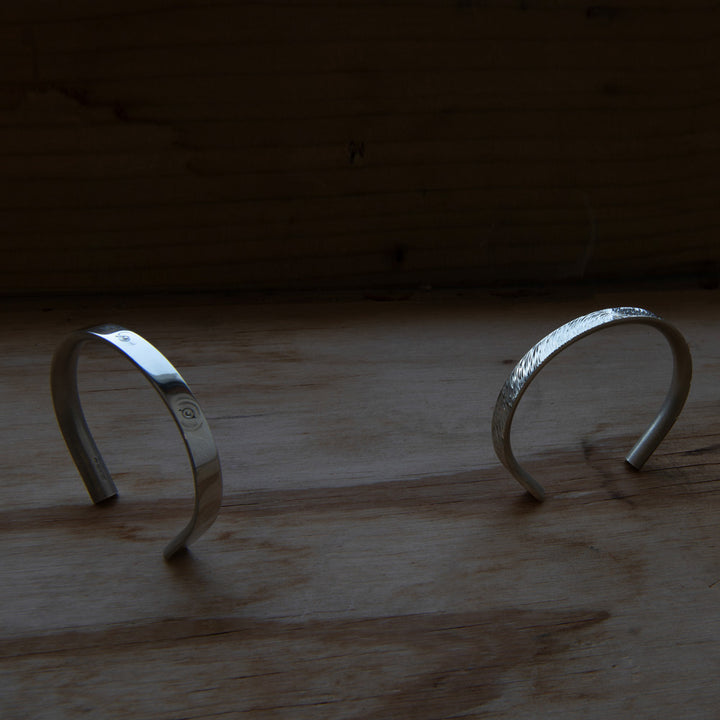 Solid silver bracelets for men by minimalist designer Alice Made This. 